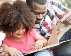 Father and daughter reading
