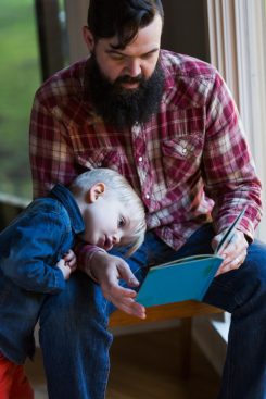 Father reading to his son