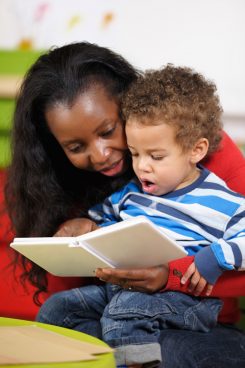 Mother reading to her son