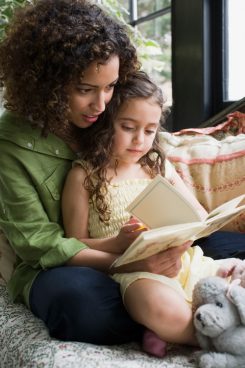 Mother and daughter reading together